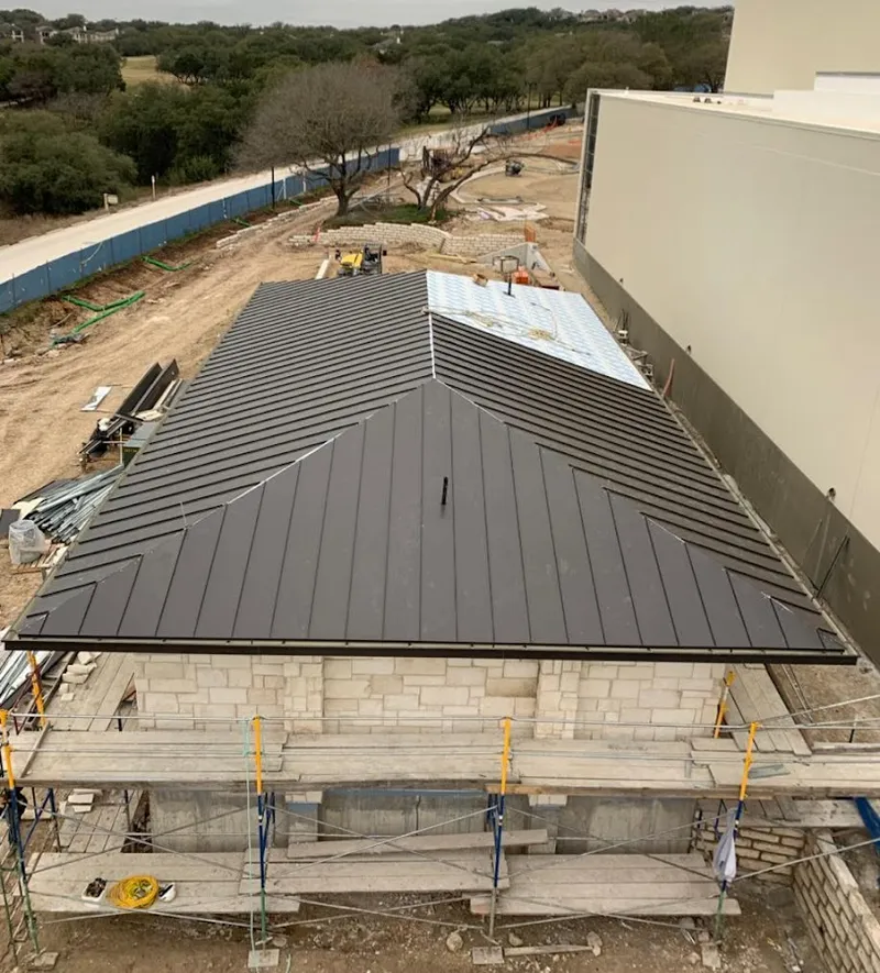 Metal roof new construction with scaffolding in Van Buren